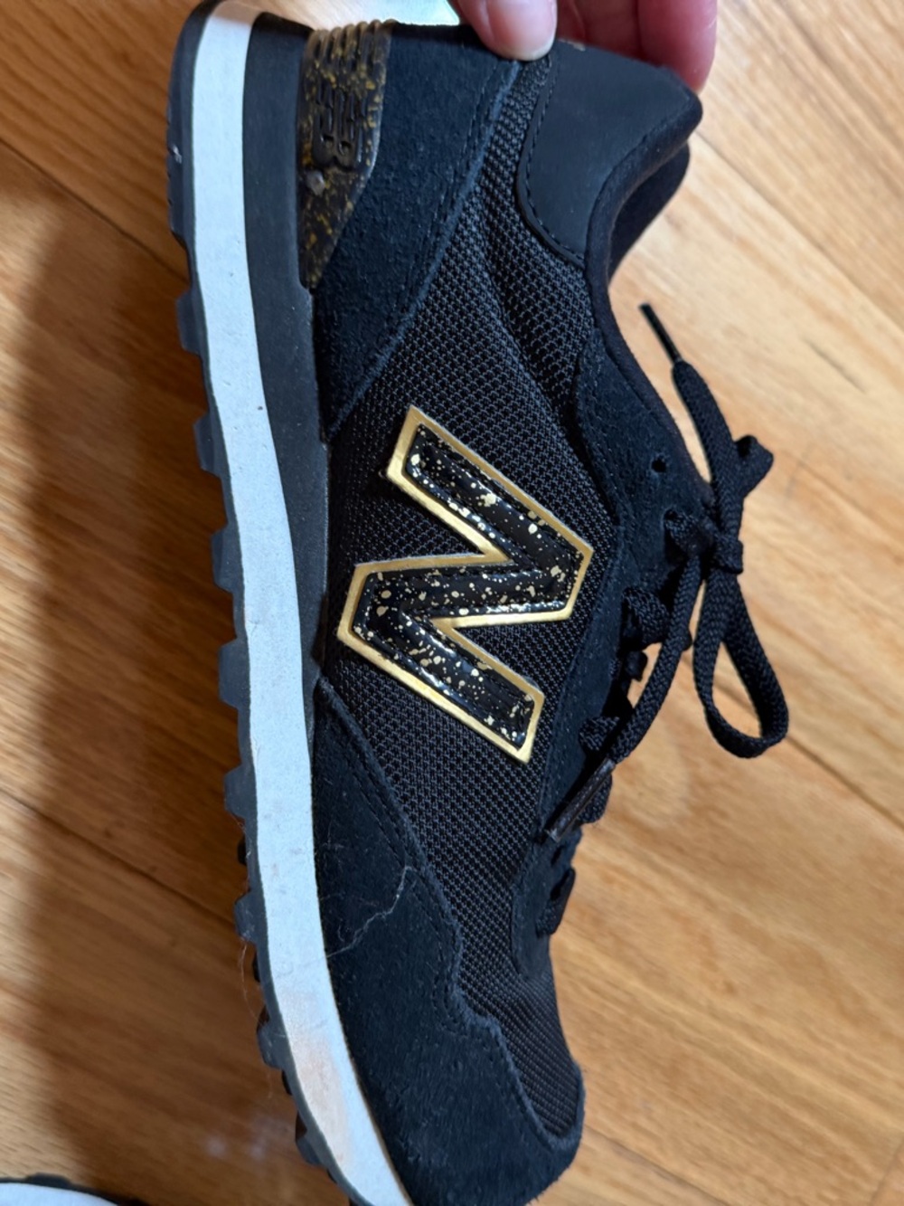 New Balance Black and Gold Athletic Sneakers